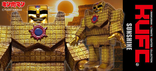 黄金のロボットフィギュアの夕日背景